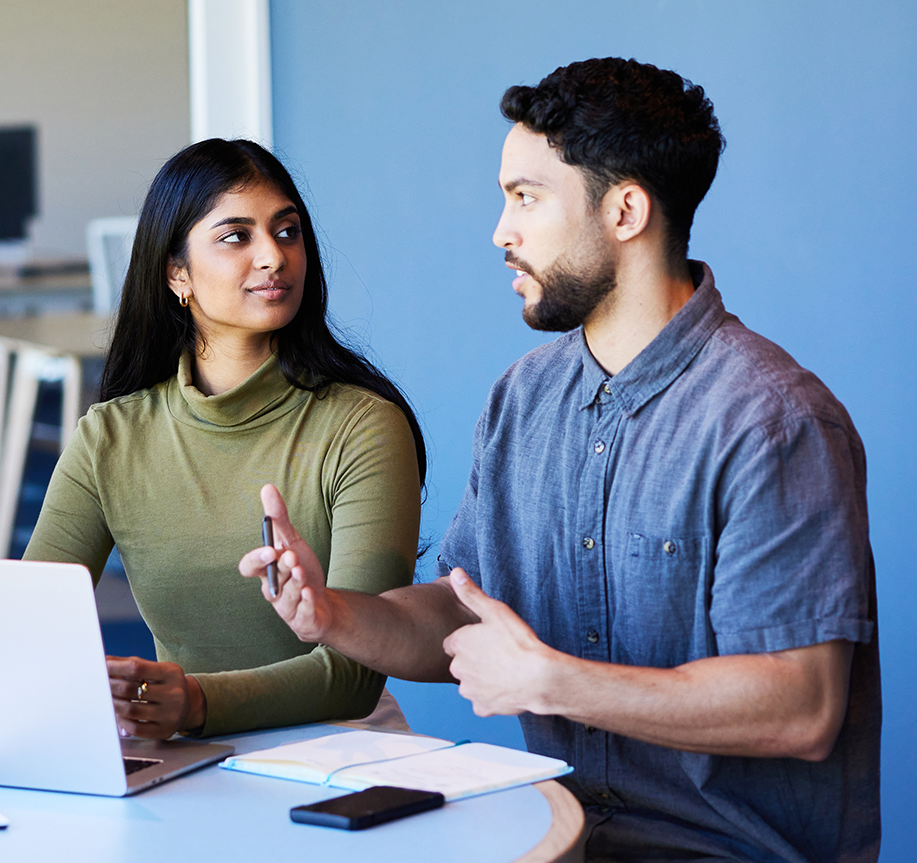 Two people discussing report